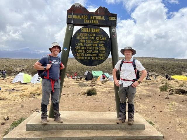 Kilimanjaro mountain guide supporting trekkers during a Tanzania climbing expedition